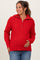 woman wearing a red maternity sweater with a zip collar and holding her baby bump