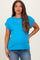 woman wearing a bright blue short sleeve maternity top and showing her baby bump