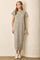 woman wearing a gray and white striped maxi dress with short sleeves and a relaxed fit