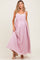 woman wearing a light pink maternity maxi dress with lace detailing and a visible baby bump