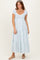 woman wearing a light blue tiered maxi dress with puff sleeves and a smocked bodice