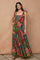 woman wearing a colorful floral maxi dress with tie straps and a tiered skirt