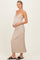 woman wearing a beige ribbed maternity dress with a v-neckline and holding her baby bump