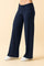 woman wearing navy blue wide-leg pants with a high waistband and white sneakers