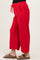 maternity wear red wide leg pants with side pockets and adjustable drawstring waistband, model showing baby bump