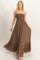 woman wearing a brown strapless maxi dress with a smocked bodice and ruffled hem