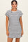 woman wearing a black and white striped short sleeve dress with a pocket detail