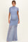 woman wearing a light blue maternity gown with ruching and a fitted silhouette, showcasing her baby bump