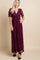pregnant woman in a burgundy lace maternity maxi dress with short sleeves and a v-neckline
