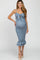 woman wearing a light blue maternity dress with a knot tie front and ruffled hem, showcasing her baby bump