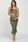 pregnant woman in olive green smocked maternity midi dress with ruffle details and spaghetti straps