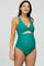 woman wearing a green maternity one-piece swimsuit with a twist front and ruched sides, showcasing her baby bump
