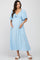 woman wearing a light blue maternity dress with a tie front and flutter sleeves, showing her baby bump