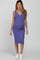 woman wearing a lavender ribbed maternity dress with a v-neck and a visible baby bump