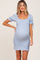 pregnant woman wearing a light blue floral smocked maternity dress with puff sleeves