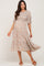 woman wearing a floral maternity midi dress with puffed sleeves and a baby bump visible