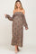 woman wearing a floral off-the-shoulder maxi maternity dress with long sleeves and visible baby bump