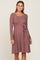 woman wearing a mauve long sleeve ribbed maternity dress with a waist tie and scoop neckline