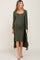 woman wearing an olive green maternity dress with a long cardigan and showing her baby bump