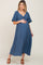 woman wearing a navy blue maternity dress with a knot detail and short sleeves, showing her baby bump