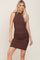 blonde woman wearing a brown sleeveless ribbed bodycon mini dress with a high neckline