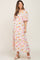 woman wearing a floral print maternity maxi dress with puff sleeves and a square neckline, showing her baby bump