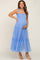 pregnant woman in a light blue tiered tulle maternity midi dress with smocked bodice and tie straps
