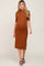 pregnant woman wearing a rust colored ribbed mock neck maternity midi dress with short sleeves