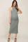 woman wearing a green ribbed maternity dress with a high neckline and a baby bump visible