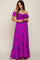 woman wearing a purple off-shoulder maternity maxi dress with gathered detailing and a flowy skirt, holding her baby bump