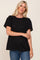blonde woman wearing a black short sleeve crew neck t-shirt and blue jeans