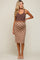 Pregnant woman wearing a brown tank top and a tan and brown checkered maternity midi skirt