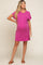 woman wearing a pink striped maternity dress with a pocket and short sleeves, showcasing her baby bump