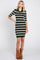 woman wearing a green and white striped polo sweater dress with brown cowboy boots