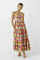 woman wearing a colorful floral maxi dress with tiered layers and spaghetti straps