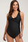 woman wearing a black maternity swimsuit with a bow detail and ruching at the sides, showcasing her baby bump