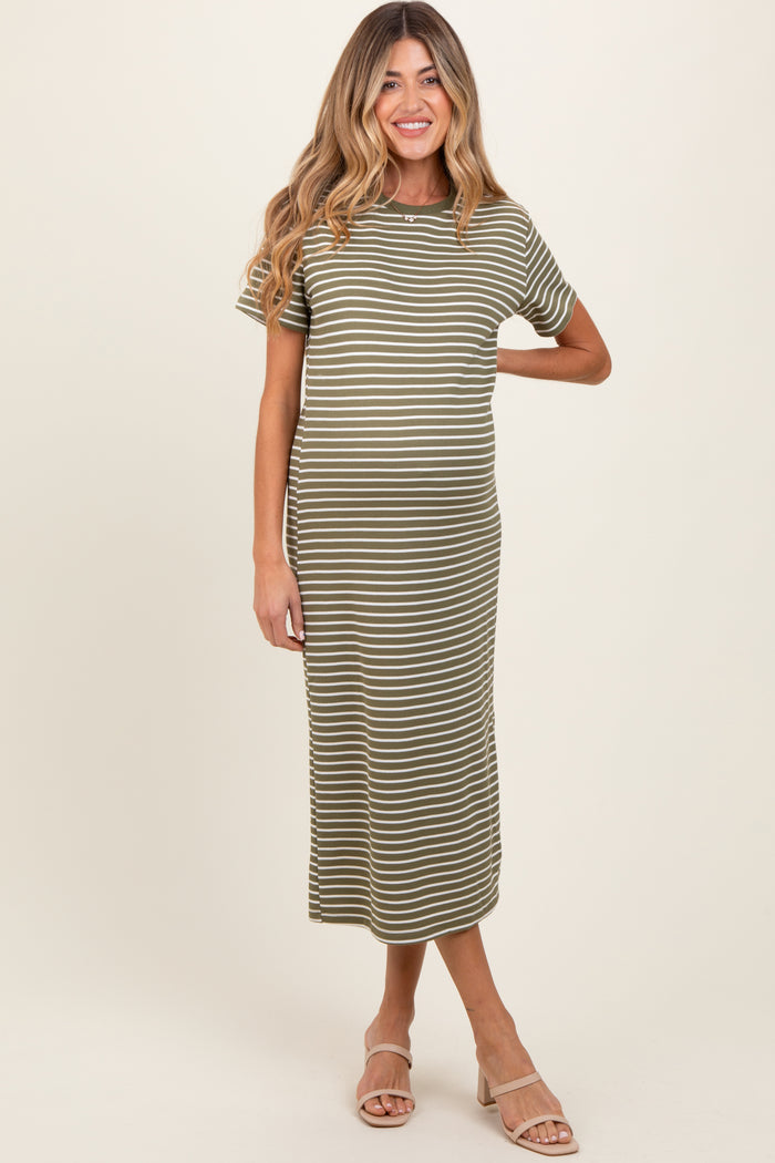woman wearing a green and white striped maternity dress with short sleeves and a baby bump visible