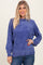 woman wearing a cozy blue oversized sweater with balloon sleeves and ribbed hem, smiling at the camera