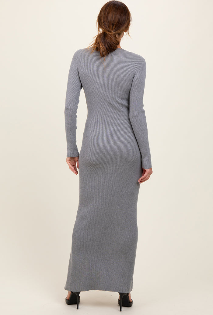 woman wearing a form-fitting gray ribbed maxi dress with long sleeves, viewed from the back