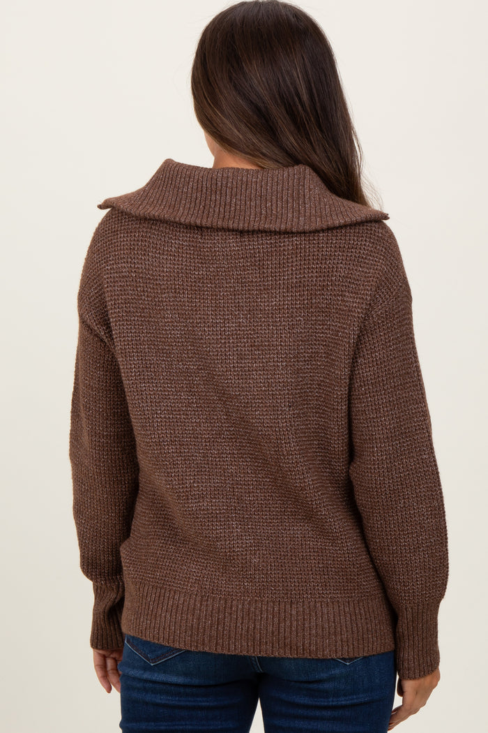woman wearing a brown oversized maternity sweater with a cozy collar, viewed from the back