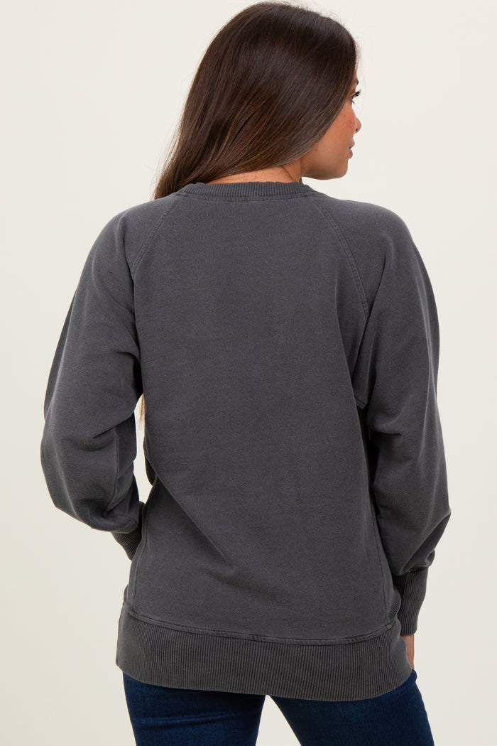 woman wearing a dark gray maternity sweatshirt with raglan sleeves, viewed from the back