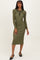 woman wearing a dark green ribbed midi dress with a collar and button details, standing against a plain background