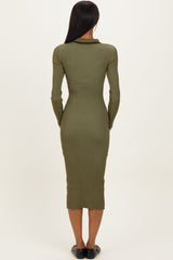 woman wearing an olive green ribbed mid-length dress with a fitted silhouette and long sleeves seen from the back