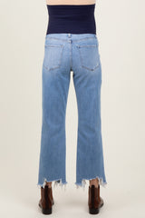 woman wearing maternity light blue cropped jeans with frayed hems, viewed from the back