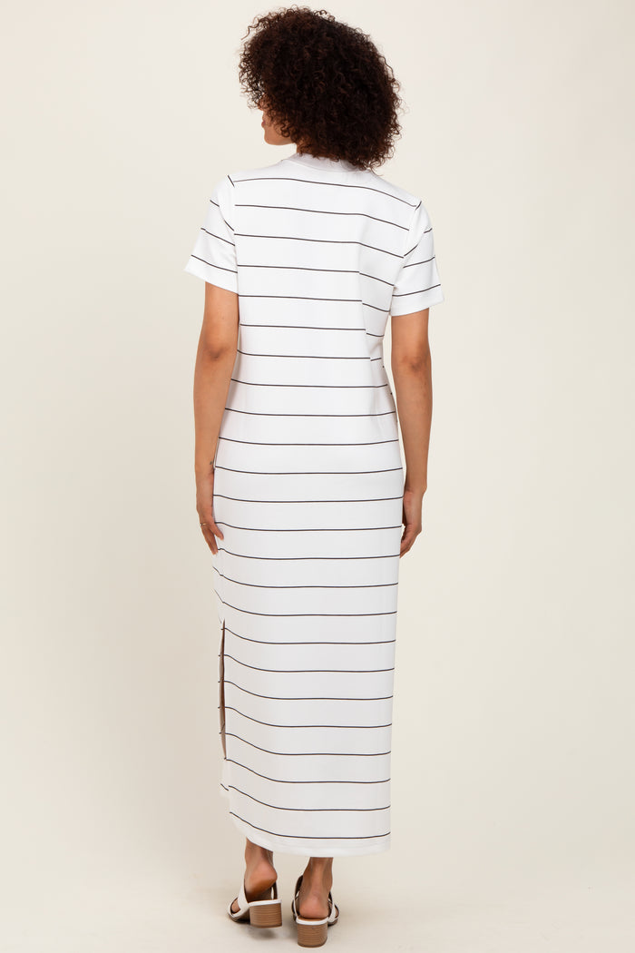 woman wearing a white striped maxi dress with short sleeves and side slits, viewed from the back