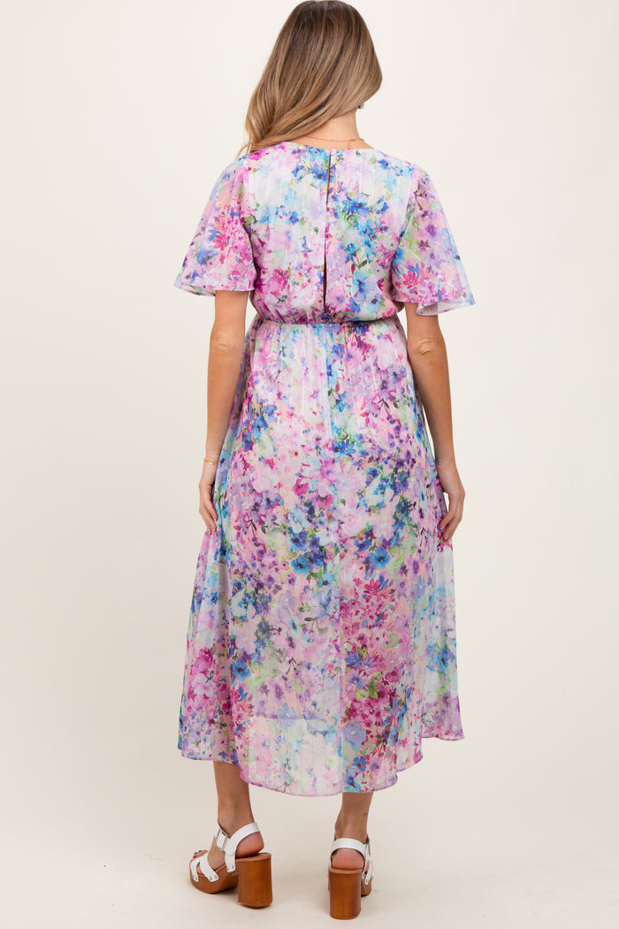 maternity wear floral maxi dress with short flutter sleeves and a cinched waist, model seen from the back
