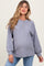 woman wearing a grey ribbed maternity top with button details and a visible baby bump