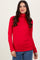 woman wearing a red long sleeve turtleneck top with fitted style and slight draping
