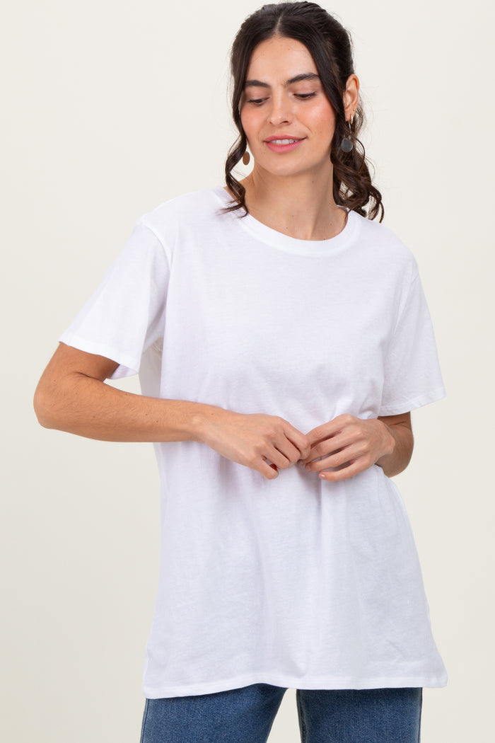 woman wearing a white short sleeve t-shirt with a relaxed fit and round neckline