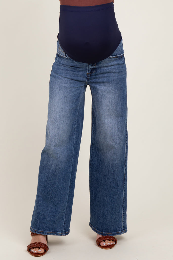 maternity wear wide-leg blue jeans with a supportive belly band, model standing with feet apart